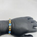 Cierre del brazalete de hombre en oro 18k con ópalos
